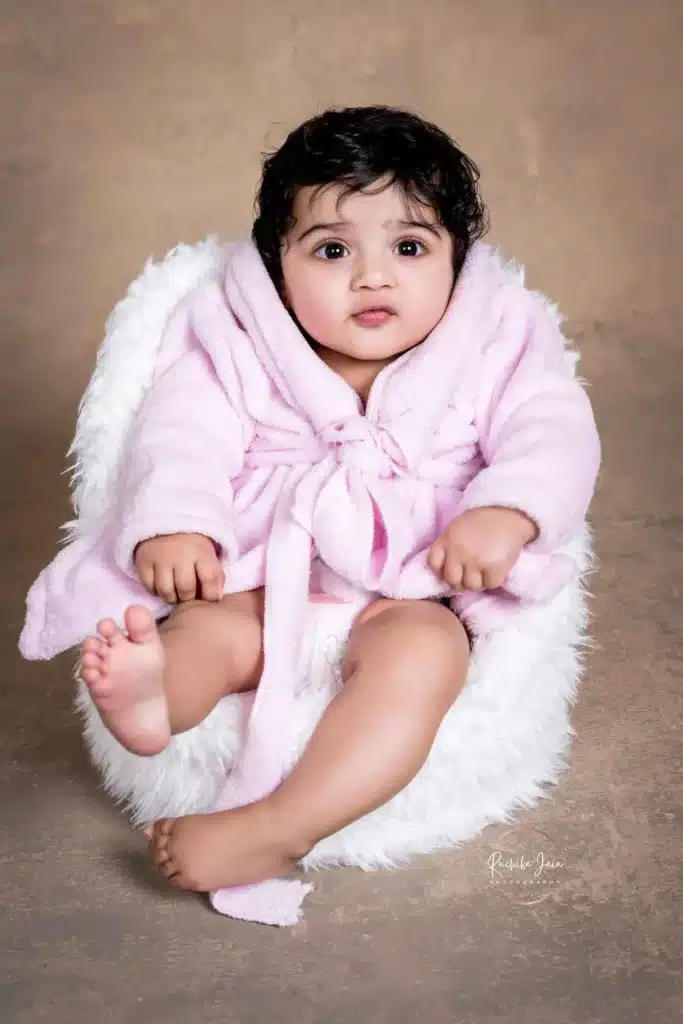 Siblings holding hands in a classic portrait by a Wellington photographer